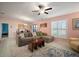 Bright living room featuring modern furnishings and an open connection to the dining area at 5425 Rainwood Meadows Dr, Apollo Beach, FL 33572
