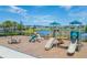 Community playground with swings, slides, and climbing structures, perfect for Gathering fun at 5425 Rainwood Meadows Dr, Apollo Beach, FL 33572