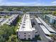 Scenic aerial view of the community showcasing the complex's layout amidst lush landscaping and various buildings at 5971 Terrace Park N Dr # 307, St Petersburg, FL 33709