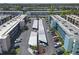 Wide aerial view showing the community's layout, featuring ample parking, landscaping and multiple condo buildings at 5971 Terrace Park N Dr # 307, St Petersburg, FL 33709
