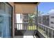 Balcony with awnings and tile floor, offering a serene outdoor living space with views of the complex at 5971 Terrace Park N Dr # 307, St Petersburg, FL 33709