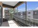 Screened-in balcony with tile flooring offers an outdoor living space with views of the surrounding complex buildings at 5971 Terrace Park N Dr # 307, St Petersburg, FL 33709