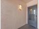 Front entrance door to unit 307 with outdoor light fixture at 5971 Terrace Park N Dr # 307, St Petersburg, FL 33709