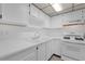 The kitchen features modern appliances, tile backsplash, and great lighting at 5971 Terrace Park N Dr # 307, St Petersburg, FL 33709