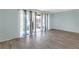 Bright living room with light blue walls and access to the balcony at 5971 Terrace Park N Dr # 307, St Petersburg, FL 33709