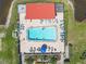 An aerial shot of the community pool with lounge chairs lined up for relaxation at 5971 Terrace Park N Dr # 307, St Petersburg, FL 33709