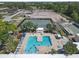 Aerial view of the community pool, tennis courts, and landscaped grounds at 5971 Terrace Park N Dr # 307, St Petersburg, FL 33709