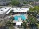 Community pool with ample seating and lush landscaping offers the perfect relaxation spot at 5971 Terrace Park N Dr # 307, St Petersburg, FL 33709