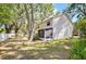 Side view of home with a screened in porch next to a yard filled with trees providing ample shade at 612 Saint Henry Dr, Brandon, FL 33511