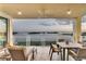 Relaxing balcony with outdoor seating offering stunning water views at 755 Collany Rd # 504, Tierra Verde, FL 33715