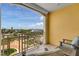 Spacious balcony offering views of lush landscaping and a bright, sunny sky at 755 Collany Rd # 504, Tierra Verde, FL 33715