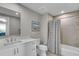 Bright bathroom with a single vanity, combined shower and tub, and modern fixtures at 755 Collany Rd # 504, Tierra Verde, FL 33715