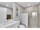 Sleek bathroom with a glass-enclosed shower, modern fixtures, and marble-style tile at 755 Collany Rd # 504, Tierra Verde, FL 33715