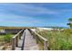Stroll along the boardwalk to the sandy beach for a day of sun, sand, and surf at 755 Collany Rd # 504, Tierra Verde, FL 33715