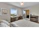 Well-lit bedroom with desk, outdoor views, and a balcony showcasing bright, airy living space at 755 Collany Rd # 504, Tierra Verde, FL 33715