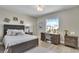 Well-lit bedroom with workspace, window view, and coordinated decor providing comfort and functionality at 755 Collany Rd # 504, Tierra Verde, FL 33715