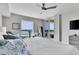 Well-lit bedroom with a view of the water, a balcony, and comfortable seating at 755 Collany Rd # 504, Tierra Verde, FL 33715