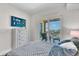 Cozy bedroom featuring a walkout balcony and an elegant blue-themed decor at 755 Collany Rd # 504, Tierra Verde, FL 33715