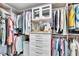 Well-organized closet with shelves, drawers, hanging rods, and mirrored accents providing optimal storage and aesthetic appeal at 755 Collany Rd # 504, Tierra Verde, FL 33715