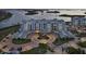 Exterior view of a condo building with lush landscaping and a circular drive at 755 Collany Rd # 504, Tierra Verde, FL 33715