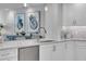 Bright kitchen with white cabinetry, stainless steel appliances, quartz countertop and mosaic backsplash at 755 Collany Rd # 504, Tierra Verde, FL 33715