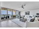 Bright and airy living room featuring large windows, water views, modern furnishings and decor at 755 Collany Rd # 504, Tierra Verde, FL 33715