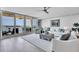 Bright living room with expansive water views through sliding glass doors and coastal decor at 755 Collany Rd # 504, Tierra Verde, FL 33715