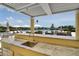 Luxury pool and outdoor bar with covered seating and beautiful views at 755 Collany Rd # 504, Tierra Verde, FL 33715