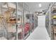 Community storage units with metal wire cages for easy access and organization at 755 Collany Rd # 504, Tierra Verde, FL 33715