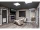 Finished basement features a fireplace, chalkboard, and relaxing chaise lounge chairs at 758 Claudia Ln, Palm Harbor, FL 34683