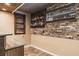 Finished basement featuring a wet bar with custom shelving and a window at 758 Claudia Ln, Palm Harbor, FL 34683