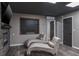 Finished basement with comfortable seating, a fireplace and chalkboard at 758 Claudia Ln, Palm Harbor, FL 34683