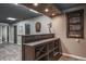 Finished basement bar area featuring a dart board and wine rack at 758 Claudia Ln, Palm Harbor, FL 34683