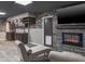 Finished basement offers a modern fireplace, wet bar and comfortable seating at 758 Claudia Ln, Palm Harbor, FL 34683