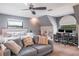 Spacious bedroom with a bed, sitting area, ceiling fan, desk, and office space at 758 Claudia Ln, Palm Harbor, FL 34683