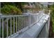 Outdoor deck with white railings overlooking lush greenery at 758 Claudia Ln, Palm Harbor, FL 34683