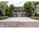 Charming two-story home with a spacious porch, two-car garage, and tropical landscaping at 758 Claudia Ln, Palm Harbor, FL 34683