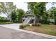 Charming two-story home with a spacious porch and mature trees at 758 Claudia Ln, Palm Harbor, FL 34683