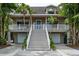 Inviting two-story home with a welcoming front porch, two-car garage, and easy access at 758 Claudia Ln, Palm Harbor, FL 34683
