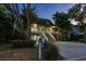 This two-story home features a lovely front yard, two garage spaces, and a welcoming staircase at 758 Claudia Ln, Palm Harbor, FL 34683