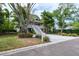 Charming two-story home with a spacious porch and well-maintained landscaping at 758 Claudia Ln, Palm Harbor, FL 34683
