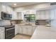 Well-appointed kitchen featuring modern appliances, stylish countertops, and a sink with a garden window at 758 Claudia Ln, Palm Harbor, FL 34683