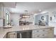 Spacious kitchen showcasing stainless steel appliances, sleek countertops, and barstool seating, perfect for casual dining at 758 Claudia Ln, Palm Harbor, FL 34683
