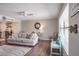 Spacious living room with beach-themed decor and comfortable seating, perfect for relaxing and entertaining at 758 Claudia Ln, Palm Harbor, FL 34683