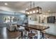 Open-concept living space connecting living, dining, and kitchen areas, perfect for modern living at 758 Claudia Ln, Palm Harbor, FL 34683