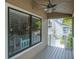 Inviting porch with ceiling fan and neighborhood views at 758 Claudia Ln, Palm Harbor, FL 34683