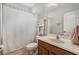 Cozy bathroom featuring a patterned shower curtain, a single vanity, and a neutral color scheme at 7606 S Sparkman St, Tampa, FL 33616