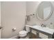 Powder room with modern vanity, attractive mirror, and fixtures at 7606 S Sparkman St, Tampa, FL 33616