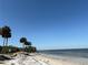 Waterfront view of beach with palm trees at 7606 S Sparkman St, Tampa, FL 33616