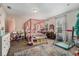 Bright and spacious bedroom with a canopy bed, neutral carpeting, and playful decor at 7606 S Sparkman St, Tampa, FL 33616